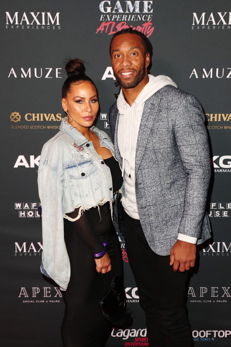 Larry Fitzgerald (R) and Melissa Fitzgerald attend The Maxim Big Game Experience (Photo by Joe Scarnici/Getty Images for Maxim)